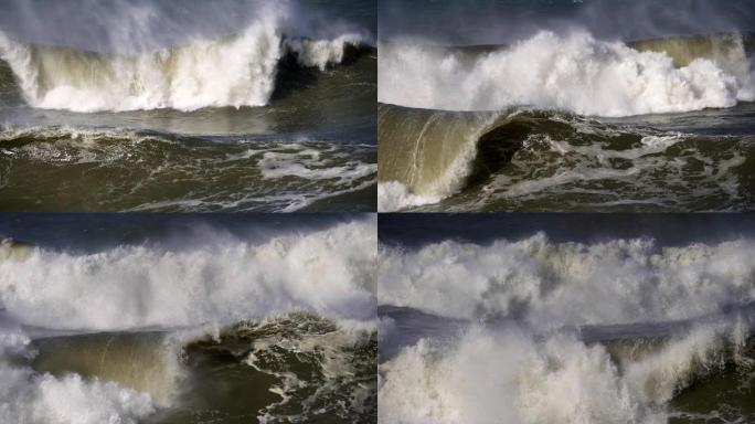 暴风雨来了。绿色泡沫波在葡萄牙的大西洋表面滚动并袭击海岸。慢动作镜头