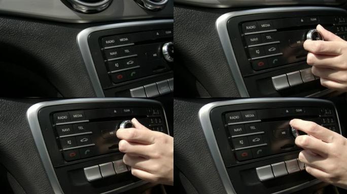亚洲女性手动按下On按钮打开现代豪华车上的收音机