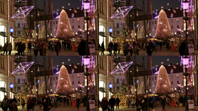 斯洛文尼亚卢布尔雅那，晚上在小镇广场上漫步，广场上装饰着圣诞树和灯光