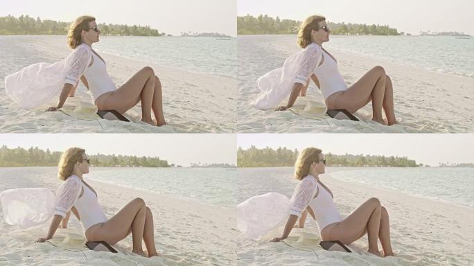 Serene女士女士在马尔代夫的热带白色沙滩上放松身心