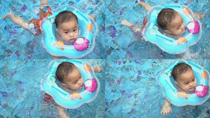 婴儿在游泳池游泳婴儿在游泳池游泳