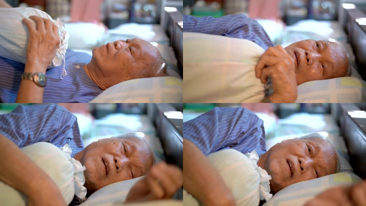 4k孤独亚洲老人躺在床上哭在家