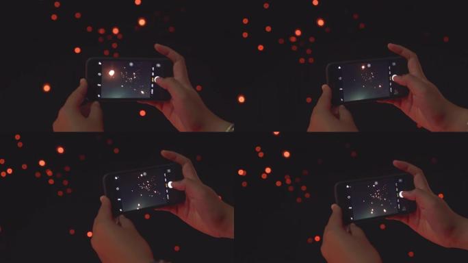 女人用智能手机手拍天灯图片