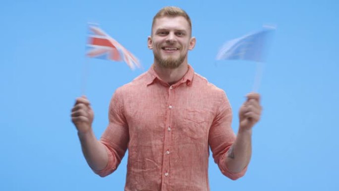 男子挥舞着欧洲国旗和英国国旗