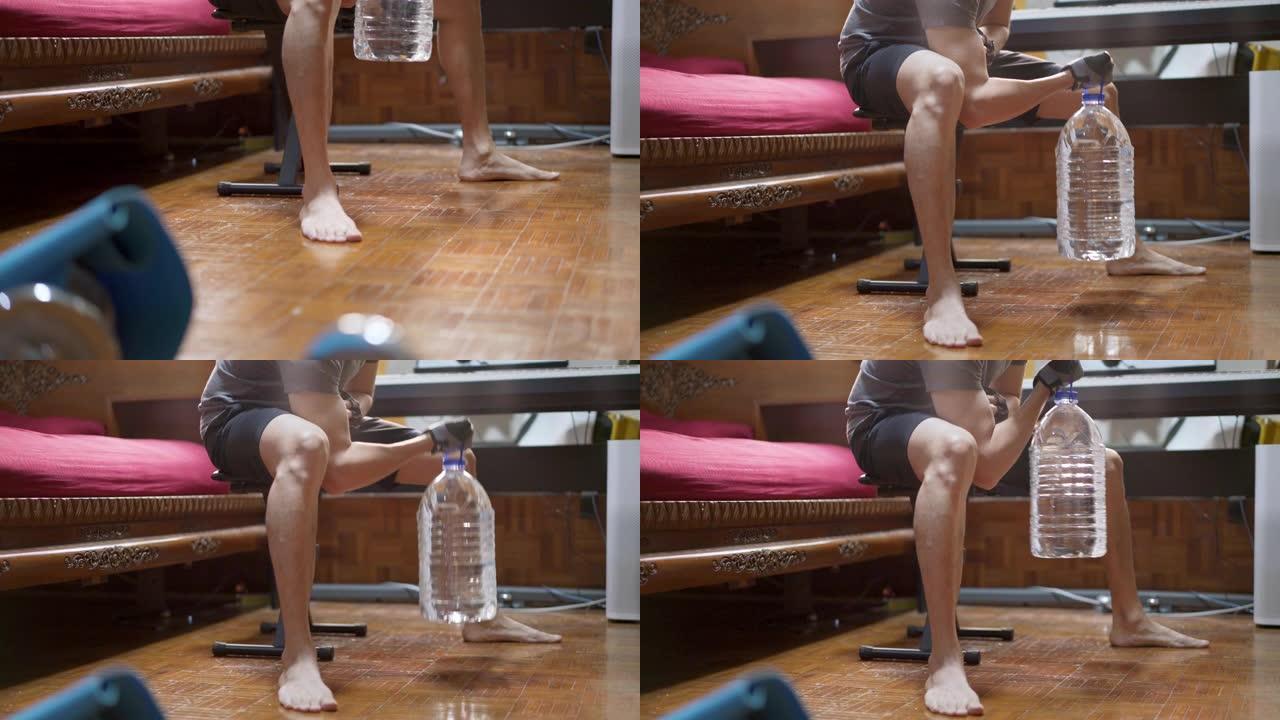 在新型冠状病毒肺炎或电晕病毒情况下，用塑料加仑水瓶代替健身房举重倾斜亚洲男子在家锻炼