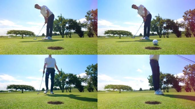 高尔夫球手试图将球打入草地上的洞中。高尔夫球场上的高尔夫球手。