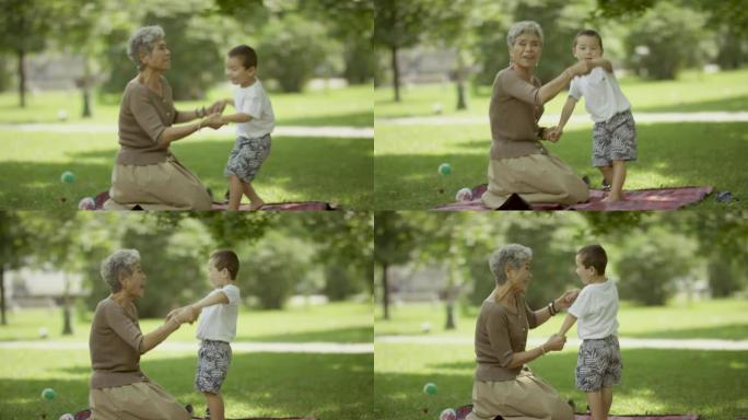 微笑的几代人亲子互动祖孙玩耍草地玩耍