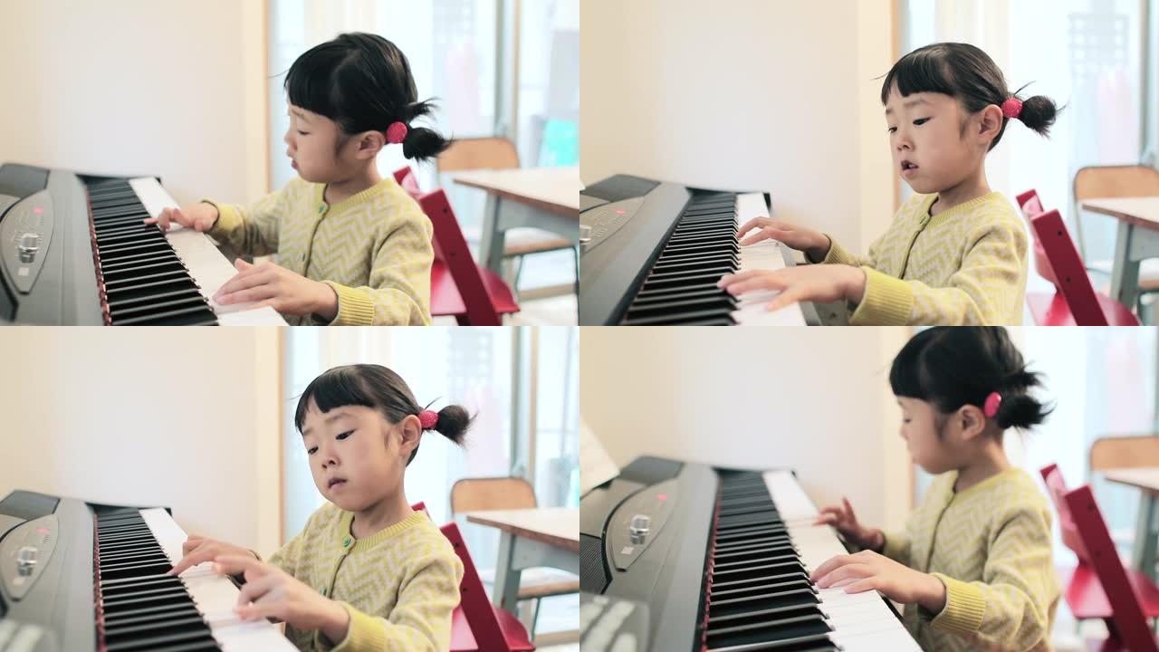 一个日本人练习钢琴的孩子