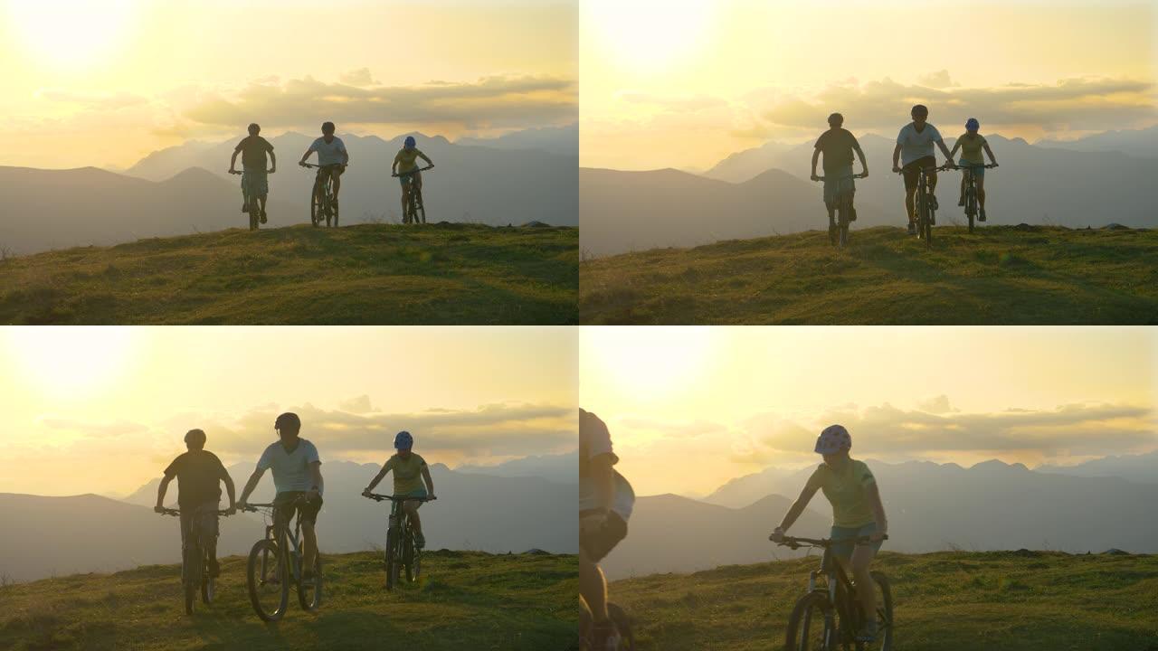 在一个阳光明媚的夜晚，三名运动游客骑着电动自行车穿过草地。