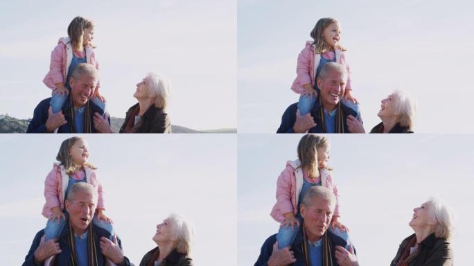 祖父让孙女与祖母一起在乡下散步时骑在肩膀上