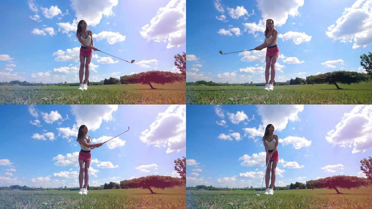 女高尔夫球手在球场上打球时击球。