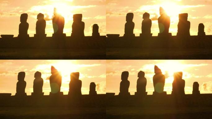太阳耀斑: 金色的日落照亮了复活节岛上的一排摩艾雕像。