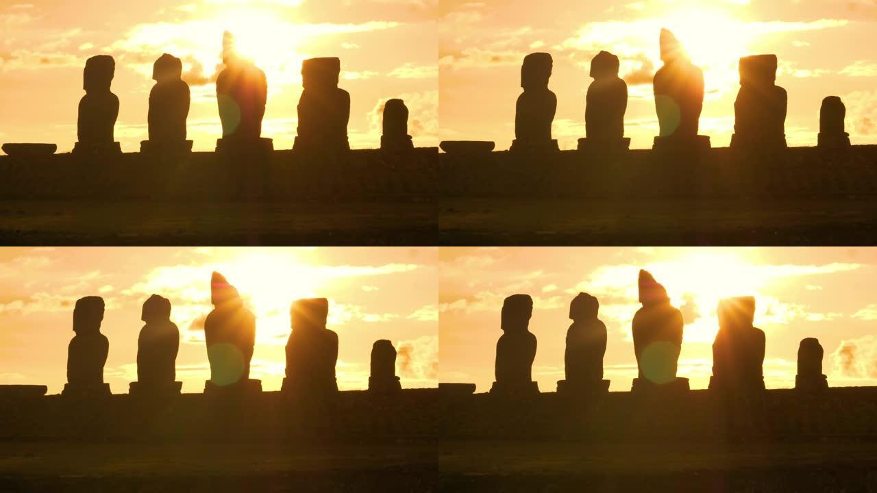 太阳耀斑: 金色的日落照亮了复活节岛上的一排摩艾雕像。
