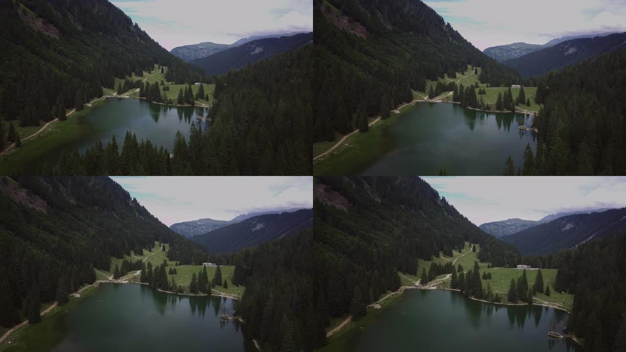 在一个神奇，放松和绿色的地方，被大自然包围的山湖的空中拍摄。