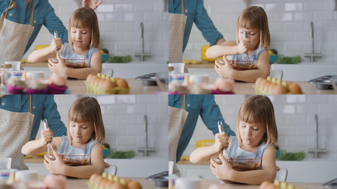 在厨房里: 可爱的小女儿的肖像，将面粉和水混合在一起，为纸杯蛋糕制作面团。家庭一起煮松饼。可爱的孩子