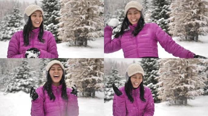 嬉戏的亚洲女性朋友在冬天享受和扔雪球