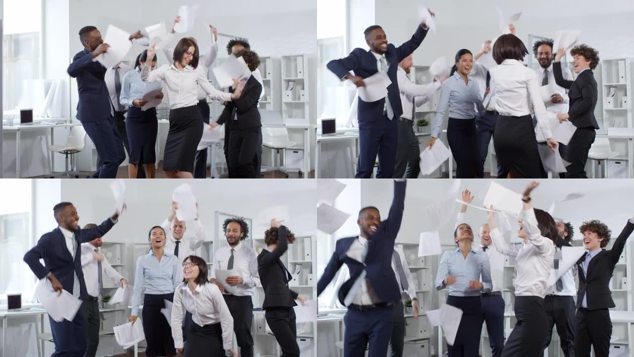 无忧无虑的商人在办公室跳舞