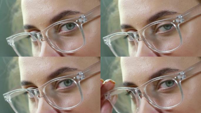 戴着透明眼镜的女人盯着相机