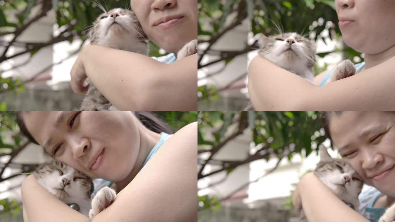 一个女人正在拥抱她的猫