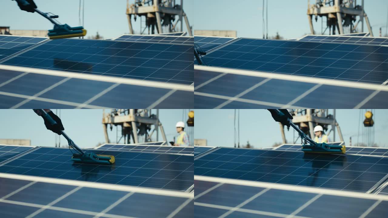 技术人员清洁平屋顶上的太阳能电池板