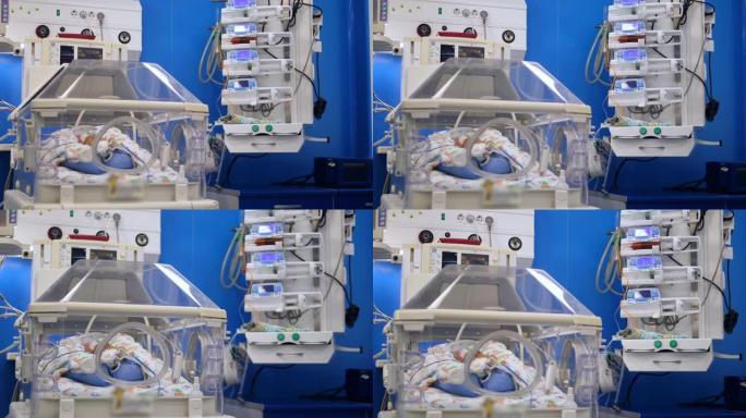 当婴儿躺在孵化器中时，医疗机器会工作。