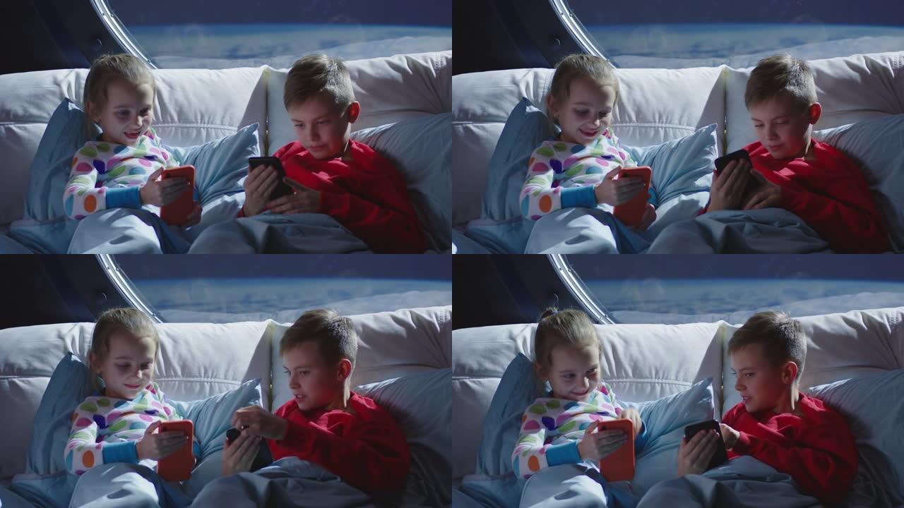 男孩和女孩在床上使用手机
