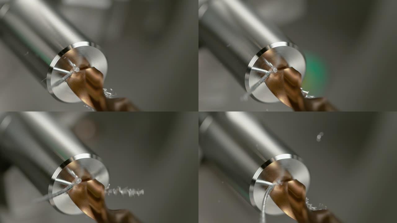 宏观，dop: 锋利的黄铜钻头在金属棒的中心钻孔。