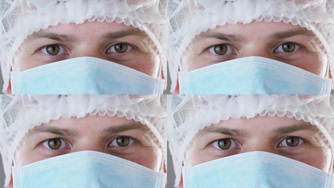 医院或诊所里戴医用口罩、呼吸器、棕色眼睛、手术帽的医生或外科医生的肖像