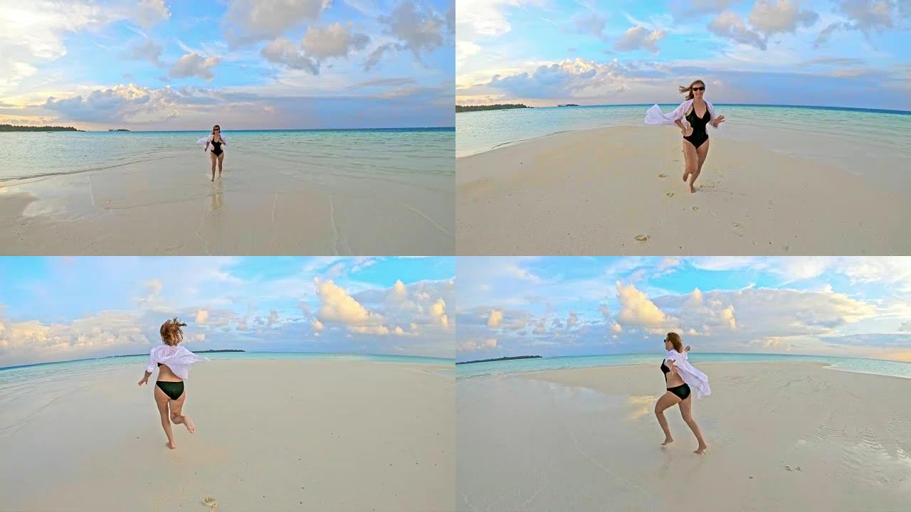 无忧无虑的女士在田园诗般的热带海洋海滩上奔向相机