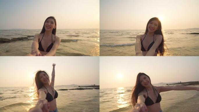 慢动作中镜头视点: 性感的亚洲美女感到幸福，享受并爱上了她的男朋友在夏天的热带海滩上日落的天空和大海