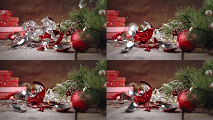 SLO MO圣诞球落在地板上，被压成碎片