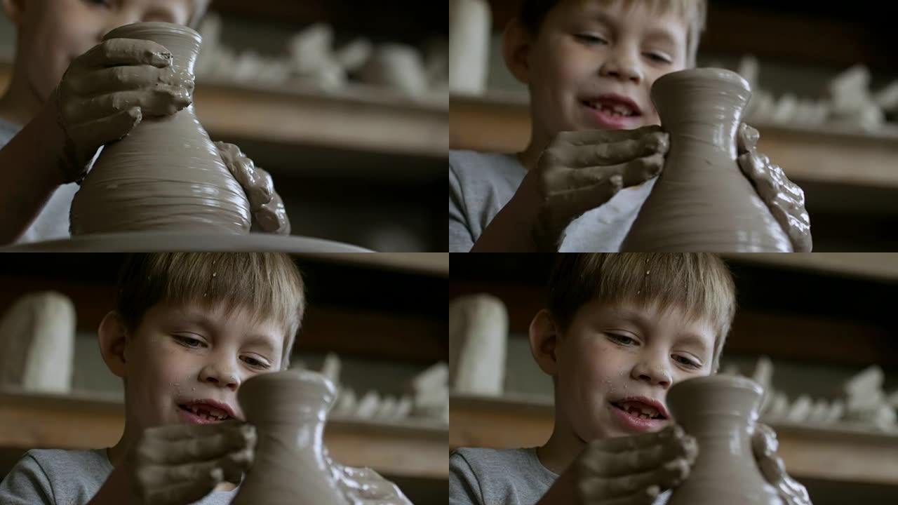 快乐的男孩在陶艺课上做花瓶
