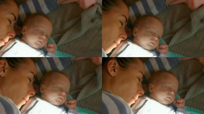 母亲和她的男婴在家睡觉4k