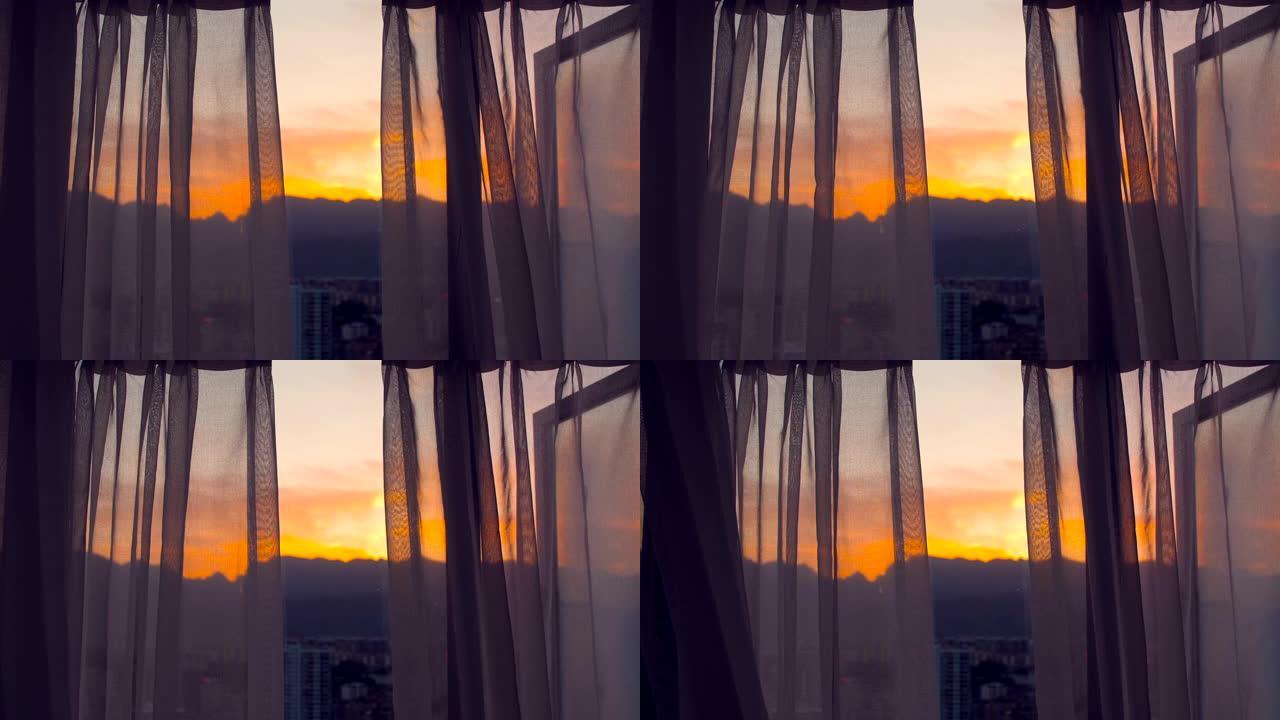 透过窗帘观看日出天空、房子、窗户、