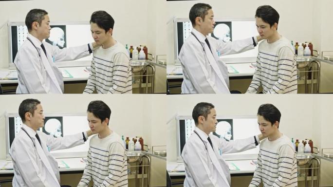 日本男性医生检查年轻男性患者