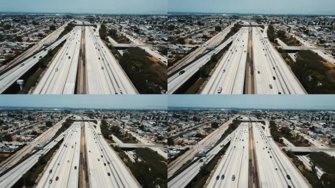 无人驾驶飞机在大型繁忙的美国州际公路上飞来飞去，有桥梁和天桥，汽车向四面八方移动。