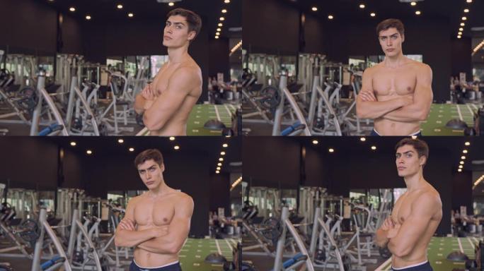 4k分辨率慢动作肖像年轻英俊男子展示强壮的健美运动员展示他肌肉健康的身体概念