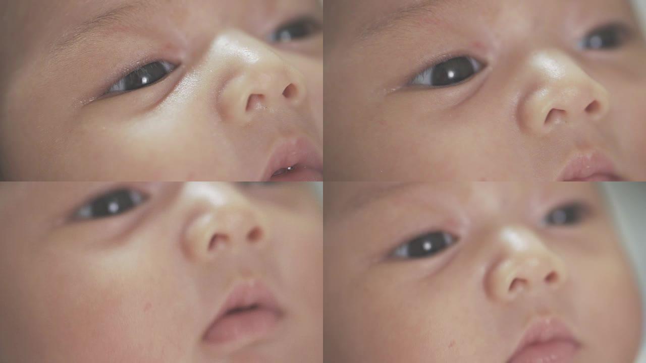 4k镜头在亚洲婴儿新生眼睛上关闭