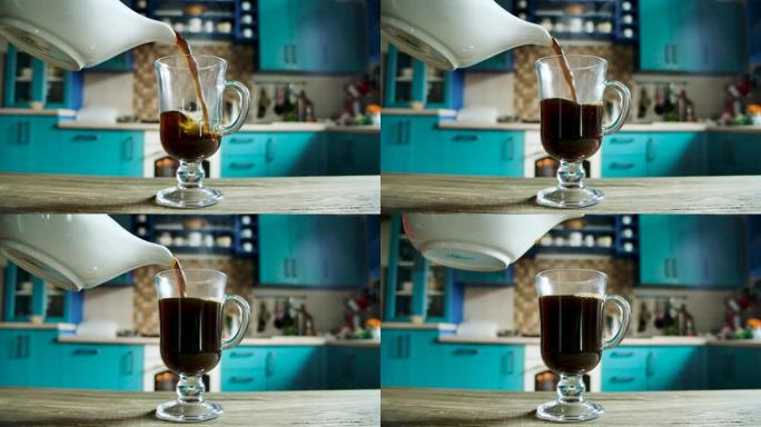 将咖啡或茶的热饮慢慢倒入玻璃杯中