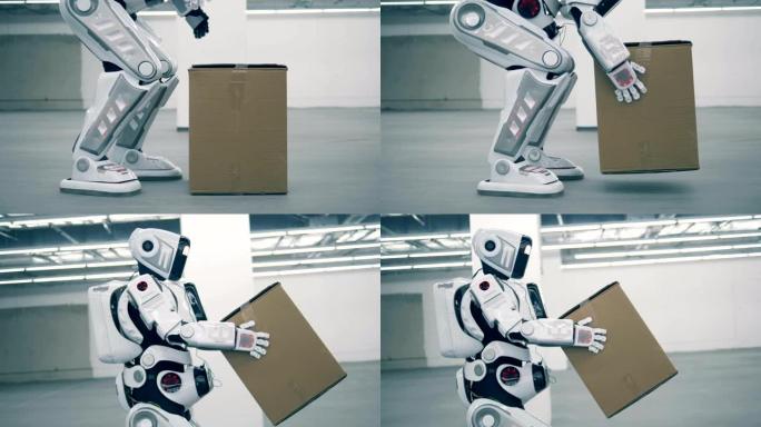 类人机器人正在举起一个盒子并搬运它