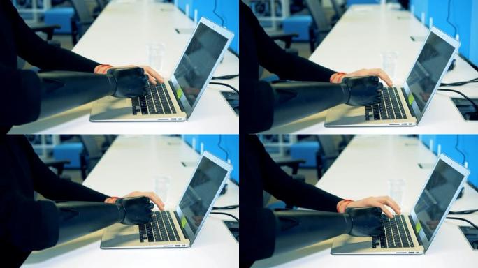 人工和人类的手打字键盘。机器人机器人臂概念。