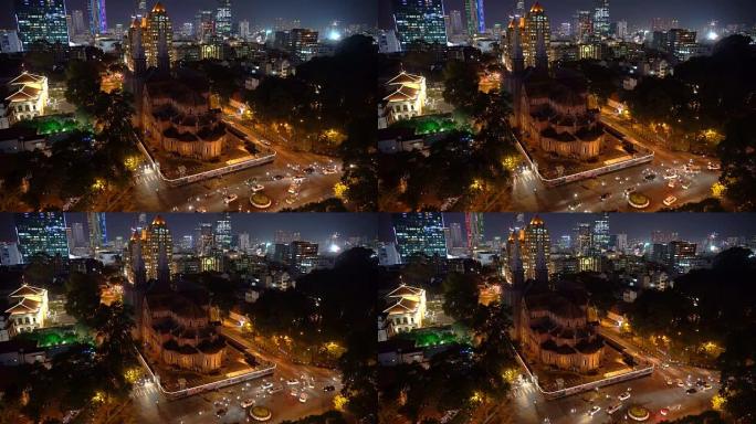 4k镜头场景西贡巴黎圣母院大教堂的城市生活从越南胡志明市夜间的俯视图，城市景观和建筑概念