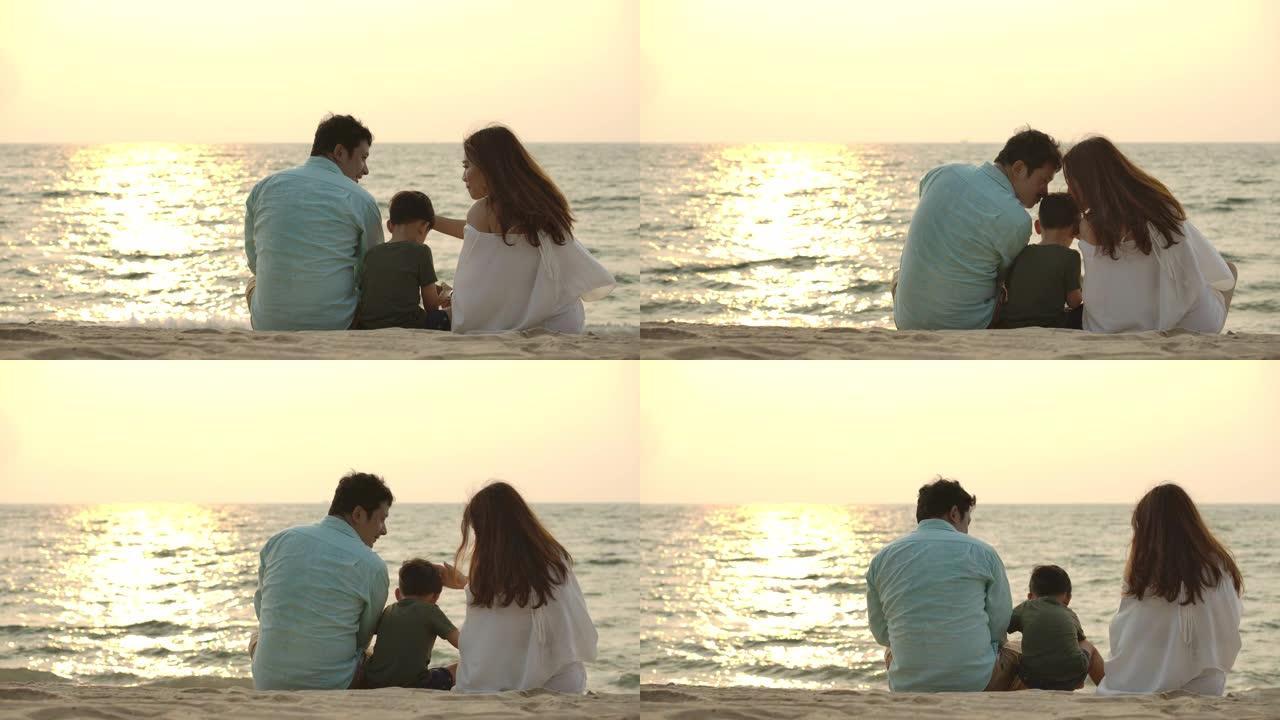 剪影快乐的亚洲家庭，一起在日落时在海滩上日落。慢动作。家庭、假期和旅行概念。