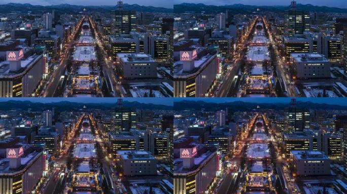 札幌电视塔的大通公园俯视图，黄昏时商业区有红绿灯。