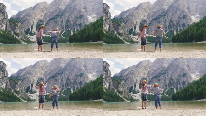两个小姑娘，头上戴着一顶草帽，在湖边，互相嬉戏，欣赏风景，她们相拥，因为彼此相爱。