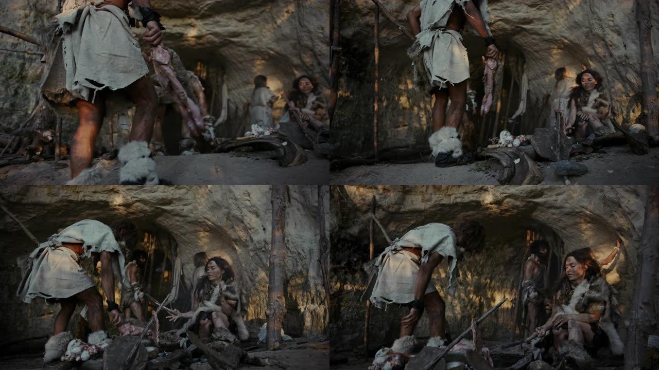 穿着动物皮的狩猎采集者部落生活在一个山洞里。领导者从狩猎中带来动物猎物，女性在篝火上烹饪食物，女孩在