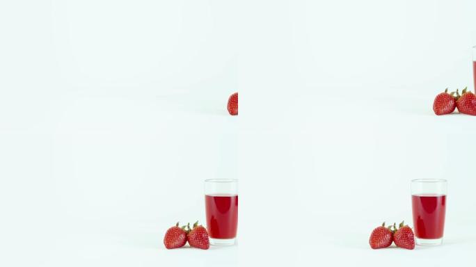 白色桌子上摆满一杯草莓汁