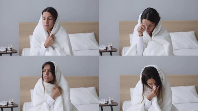 生病的年轻女子被毯子吹鼻子被流感