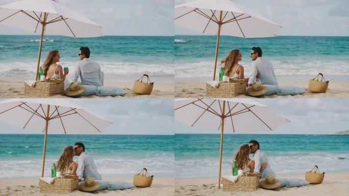 浪漫的情侣在海滩野餐