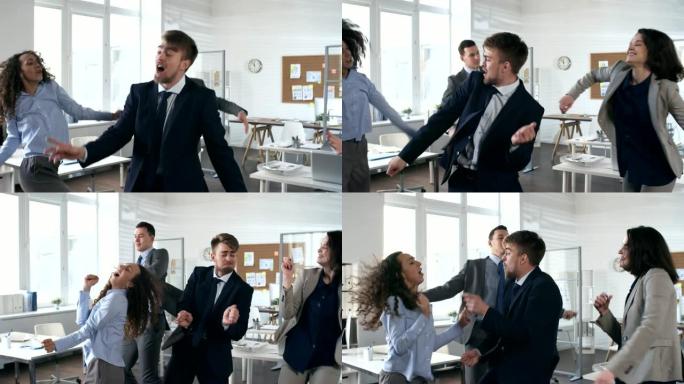 欣喜若狂的商界人士在办公室跳舞